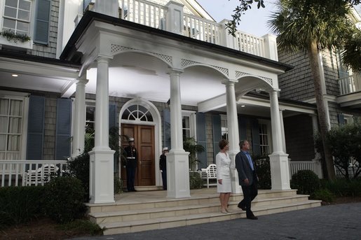 President George W. Bush and Laura Bush await the arrival of leaders attending a social dinner at the G8 Summit on Sea Island, Ga., Tuesday, June 8, 2004. White House photo by Tina Hager