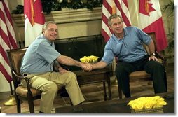 President George W. Bush and Canadian Prime Minister Paul Martin shake hands during their bilateral talks at the G-8 Summit in Sea Island, Ga., Tuesday, June 8, 2004.  White House photo by Eric Draper