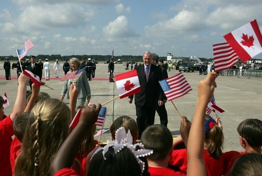 Arriving for the G8 summit at Sea Island, Ga., Canadian Prime Minister Paul Martin walks to greet an enthusiastic crowd at Hunter Air Force Base Tuesday, June 8, 2004. White House photo by Paul Morse