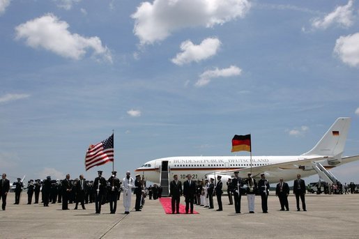 German Chancellor Gerhard Schroeder, left, and Deputy U.S. Chief of Protocol Jeff Eubank participate in an arrival ceremony at Hunter Army Airfield in Savannah, Ga., June 8, 2004. White House photo by Paul Morse