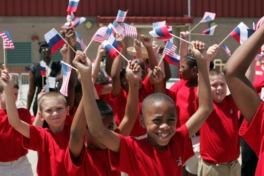 School children cheer during the arrival of Russian President Vladimir Putin at Hunter Army Airfield in Savannah, Ga., Tuesday, June 8, 2004. White House photo by Paul Morse