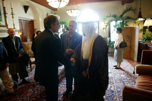 President George W. Bush looks on as Britain's Prime Minister Tony Blair and Iraq's new interim President Ghazi al-Yawer greet each other at the G8 Summit on Sea Island, Ga., Wednesday, June 9, 2004.