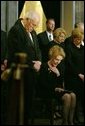 Vice President Dick Cheney, Nancy Reagan and other mourners bow their heads during the State Funeral Ceremony in the Rotunda of the U.S. Capitol Wednesday, June 9, 2004. White House photo by David Bohrer