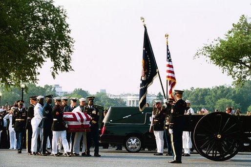 Former President Ronald Reagan's casket is transfered onto horse-drawn caisson at 1600 Constitution Avenue near the White House, Wednesday, June 9, 2004. White House photo by Joyce Naltchayan.