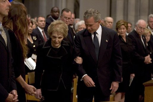 President George W. Bush escorts former First Lady Nancy Reagan to her seat before the funeral service for former President Ronald Reagan at the National Cathedral in Washington, DC on June 11, 2004. White House photo by Paul Morse.