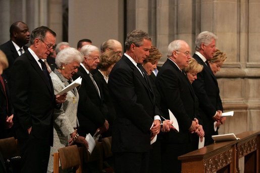 President George W. Bush bows his head during a prayer reading during the funeral service for former President Ronald Reagan at the National Cathedral in Washington, DC on June 11, 2004. White House photo by Paul Morse.