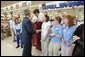 President George W. Bush greets shoppers at the Hy-Vee grocery and pharmacy store in Liberty, Mo., June 14, 2004. White House photo by Paul Morse