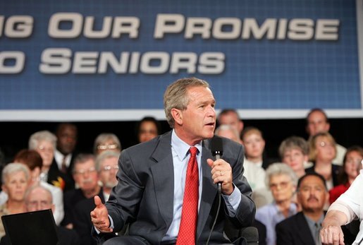 President George W. Bush makes a point during a conversation on Medicare-approved prescription drug discount cards in Liberty, Mo., June 14, 2004. White House photo by Susan Sterner