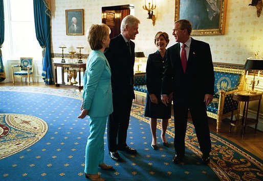 President George W. Bush and Laura Bush talk with former President Bill Clinton and Senator Hillary Clinton in the Blue Room shortly before the unveiling of the Clinton portraits in the East Room of the White House Monday, June 14, 2004. White House photo by Paul Morse