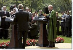 President George W. Bush and Hamid Karzai of Afghanistan hold a joint press conference in the Rose Garden Tuesday, June 15, 2004.   White House photo by Paul Morse