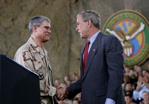President George W. Bush greets Lieutenant General Lance Smith, Commander Central Command, before delivering remarks to military personnel at MacDill Air Force Base in Tampa, Florida, Wednesday, June 16, 2004. White House photo by Eric Draper.