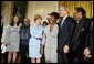 President George W. Bush and Mrs. Laura Bush pose with jazz musicians after a performance to honor Black Music Month in the East Room of the White House on June 22, 2004. White House photo by Paul Morse