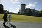Laura Bush and Irelands Deputy Chief of Protocol Joe Brennan walk along the grounds of Dromoland Castle during a day of meetings between the United States and European Union in Shannon, Ireland, Saturday, June 26, 2004.  White House photo by Joyce Naltchayan