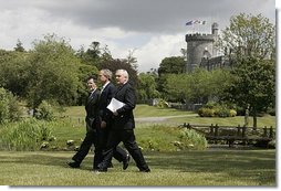 President George W. Bush walks with Prime Minister of Ireland Bertie Ahern, right, and President of the European Commission Romano Prodi on the way to their joint press conference at the Dromoland Castle in Shannon, Ireland, Saturday, June 26, 2004.  White House photo by Eric Draper