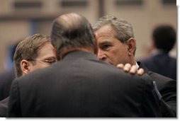President George W. Bush talks with French President Jacques Chirac during the NATO Summit at the Istanbul Convention and Exhibition Center in Turkey, Monday, June 28, 2004.