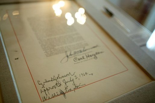 The last page of the Civil Rights Act with the signature of President Lyndon B. Johnson was on display in the White House for a reception commemorating the 40th Anniversary of the Civil Rights Act on July 1, 2004. White House photo by Paul Morse