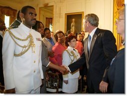 President George W. Bush greets the audience during a reception commemorating the 40th Anniversary of the Civil Rights Act at the White House on July 1, 2004.  White House photo by Paul Morse