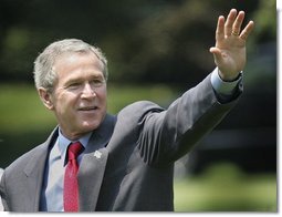 President George W. Bush waves as he departs the South Lawn for Camp David, Friday, July 2, 2004.  White House photo by Eric Draper