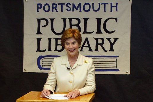 Laura Bush answers reporters questions after participating in the No Child Left Behind Summer Reading Program with local children at the Portsmouth Public Library in Portsmouth, New Hampshire, Friday, July 9, 2004. White House photo by Yoni Brook