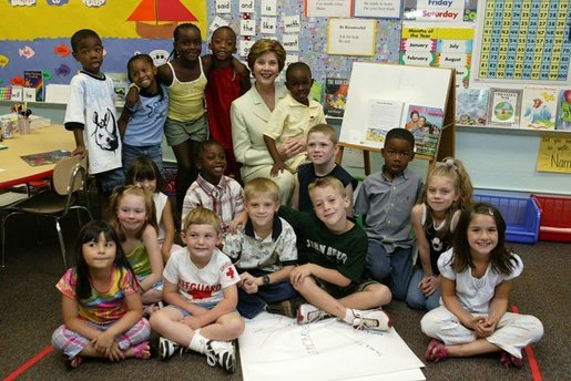 Laura Bush poses for a photo with students during a visit to Hueytown Elementary School in Birmingham, Alab., Wednesday, July 14, 2004. White House photo by Joyce Naltchayan