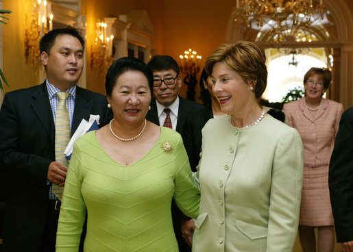 Laura Bush greets Azadsurengiin Oyunbileg, wife of President Natsagiyn Bagabandi of Mongolia, in the Yellow Oval Room Friday, July 16, 2004. White House photo by Joyce Naltchayan