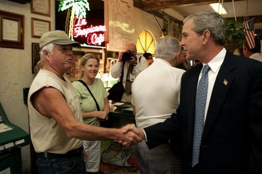 President George W. Bush visits with patrons of La Tropicana Café in Ybor City, Florida on Friday July 16, 2004. White House photo by Paul Morse