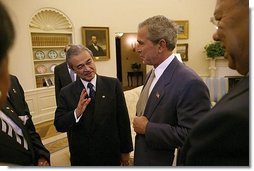 President George W. Bush and Prime Minister Abdullah Badawi of Malaysia meet in the Oval Office Monday, July 19, 2004. Also pictured are National Security Advisor Dr. Condoleezza Rice, left and Secretary of State Colin Powell.  White House photo by Tina Hager