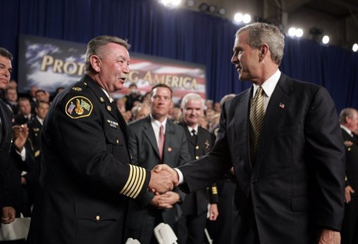 President George W. Bush greets firemen after remarks on homeland security at Northeastern Illinois Public Training Academy in Glenview, Illinois on Thursday July 22, 2004. White House photo by Paul Morse.