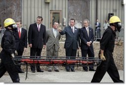 President George W. Bush observes a demonstration by first responders at Northeastern Illinois Public Training Academy in Glenview, Illinois on Thursday July 22, 2004.  White House photo by Paul Morse