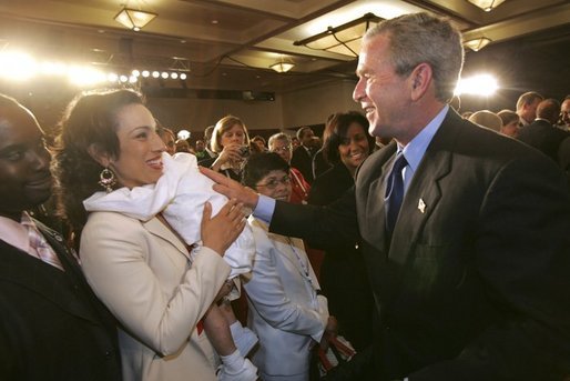 President George W. Bush meets with audience members after addressing the National Urban League Conference in Detroit, Mich., Friday, July 23, 2004. White House photo by Eric Draper
