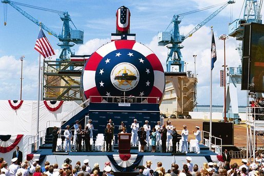 Laura Bush christens the U.S.S. Texas, a Virginia class submarine, in Newport News, Va., July 31, 2004. "Today, we celebrate the devoted service of the men and women of the United States Navy and the skill of America's shipbuilders. I'm honored to christen the triumph that is the Texas," said Mrs. Bush in her remarks. White House photo by Joyce Naltchayan