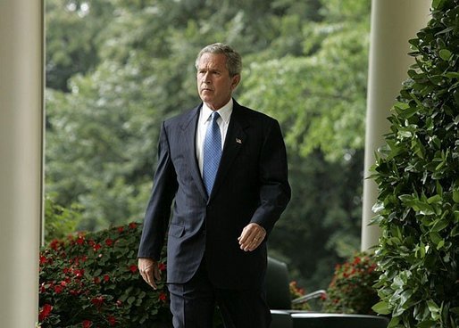 President George W. Bush enters the Rose Garden where he talks about America's intelligence reforms Monday, Aug. 2, 2004. White House photo by Paul Morse.