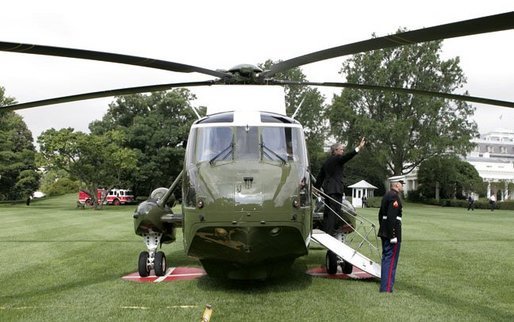 President George W. Bush waves from Marine One upon his departure from the South Lawn Tuesday, Aug. 3, 2004. White House photo by Tina Hager.
