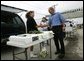 Traveling through Iowa, President George W. Bush stops by a farmers Market in Davenport, Wednesday, Aug. 4, 2004. White House photo by Eric Draper.