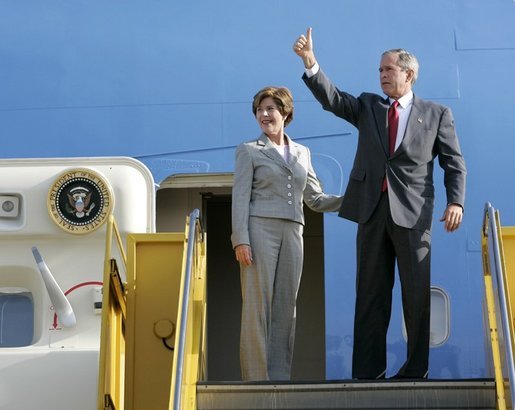 President George W. Bush gives a thumbs-up sign as he and Laura Bush depart Los Angeles Friday morning, Aug. 13. 2004. White House photo by Eric Draper.