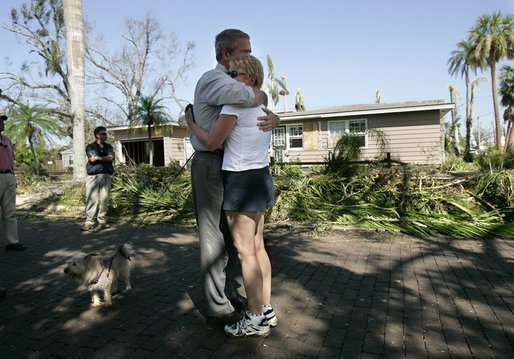President George W. Bush consoles a resident during a tour of hurricane damage in Punta Gorda, Fla., Sunday, Aug. 15, 2004.