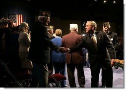 President George W. Bush greets veterans after speaking to the Veterans of Foreign Wars convention in Cincinnati, Ohio, Monday, Aug. 16, 2004.  White House photo by Paul Morse