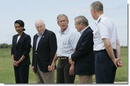 Standing with his national defense team, President George W. Bush talks with the press at Prairie Chapel Ranch in Crawford, Texas, Monday, Aug. 23, 2004. Pictured, from left, are: Dr. Condoleezza Rice, Vice President Dick Cheney, Secretary of Defense Donald Rumsfeld and Chairman of the Joint Chiefs of Staff General Richard Meyers.  White House photo by Paul Morse