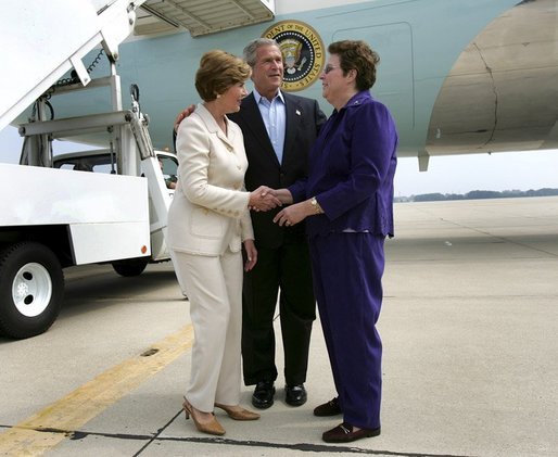 President George W. Bush introduces Mrs. Bush to USA Freedom Corps Greeter Kathy Hawkins in front of Air Force One at General Mitchell International Airport - Air Reserve Station in Milwaukee, Wisconsin, Friday, Sept. 3, 2004. Hawkins has volunteered with the Wisconsin State Veterans Home in King, Wisconsin for the past 20 years. White House photo by Eric Draper