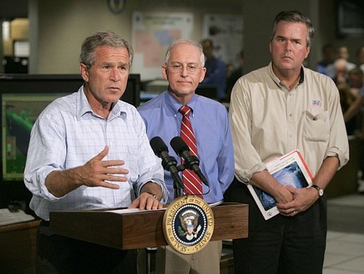President George W. Bush delivers a live statement to Floridians affected by Hurricane Frances at the National Hurricane Center in Miami, Fla., Wednesday, Sept. 8, 2004. Also pictured from left are Max Mayfield Director of the National Hurricane Center and Florida Gov. Jeb Bush. White House photo by Eric Draper