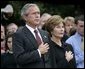 President George W. Bush and Mrs. Bush pause during the playing of Taps following the Moment of Silence on the South Lawn, Saturday, Sept. 11, 2004. White House photo by Eric Draper