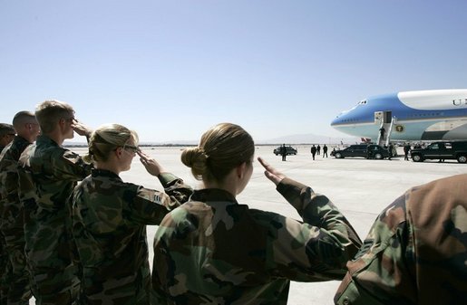 Military personnel from Nellis Air Force Base salute President George W. Bush as he boards Air Force One before departing Las Vegas, Nev., Tuesday, Sept. 14, 2004. White House photo by Eric Draper