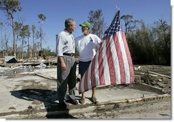 President George W. Bush talks with resident Jim Heinold during a walking tour of neighborhoods damaged by Hurricane Ivan in Pensacola, Florida, Sunday, Sept. 19, 2004  White House photo by Eric Draper