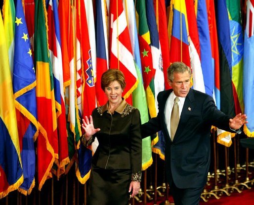 President George W. Bush and Laura Bush wave to their guests at the United States Reception at the Waldorf Astoria Hotel in New York City, Tuesday, Sept. 22, 2002. White House photo by Tina Hager.