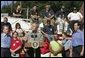President George W. Bush discusses the recovery efforts at the Millvale, Pa. Fire Department in Western Pennsylvania during a visit to the area recently flooded by Tropical Depression Ivan in Allegheny County, Wednesday, Sept. 22, 2004. White House photo by Eric Draper.