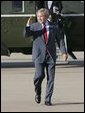 President George W. Bush salutes as he departs Waco, Texas, Monday, Sept. 27, 2004. White House photo by Eric Draper.