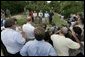 After touring the hurricane damage to Marty and Pat McKenna's orange groves, President George W. Bush addresses the media at the their farm in Lake Wales, Fla., Sept. 29, 2004.  White House photo by Eric Draper