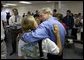 President George W. Bush shares a hug during a visit to Martin County Red Cross Headquarters in Stuart, Fla., Thursday, Sept. 30, 2004. "People in Florida and many other states are coming through a trying time," said the President in an address to the press. "I thank all those who've reached out to help the neighbors in need." White House photo by Eric Draper