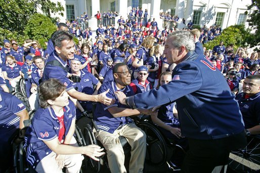 After addressing the athletes, President George W. Bush greets members of the 2004 U.S. Olympic and Paralympic Teams on the South Lawn Monday, Oct. 18, 2004. White House photo by Tina Hager