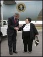 President George W. Bush talks with USA Freedom Corps Greeter Dolly Yunkunis in front of Air Force One in Wilkes-Barre, Pennsylvania, Friday, Oct. 22, 2004.   White House photo by Eric Draper